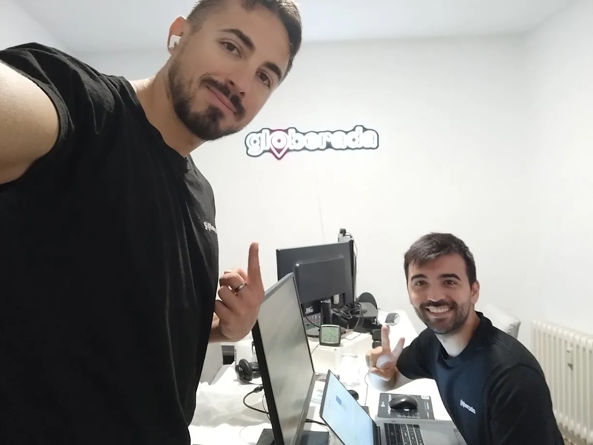 Manuel with a colleague working in the Globerada office